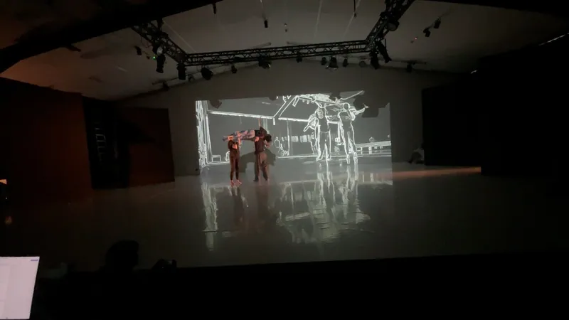 Performers on a dark stage beneath a large projected figure.