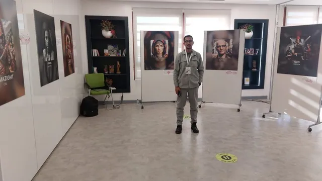 Wide view of the gallery room with framed AI portraits on white walls.